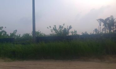 Half plot of land in abijo